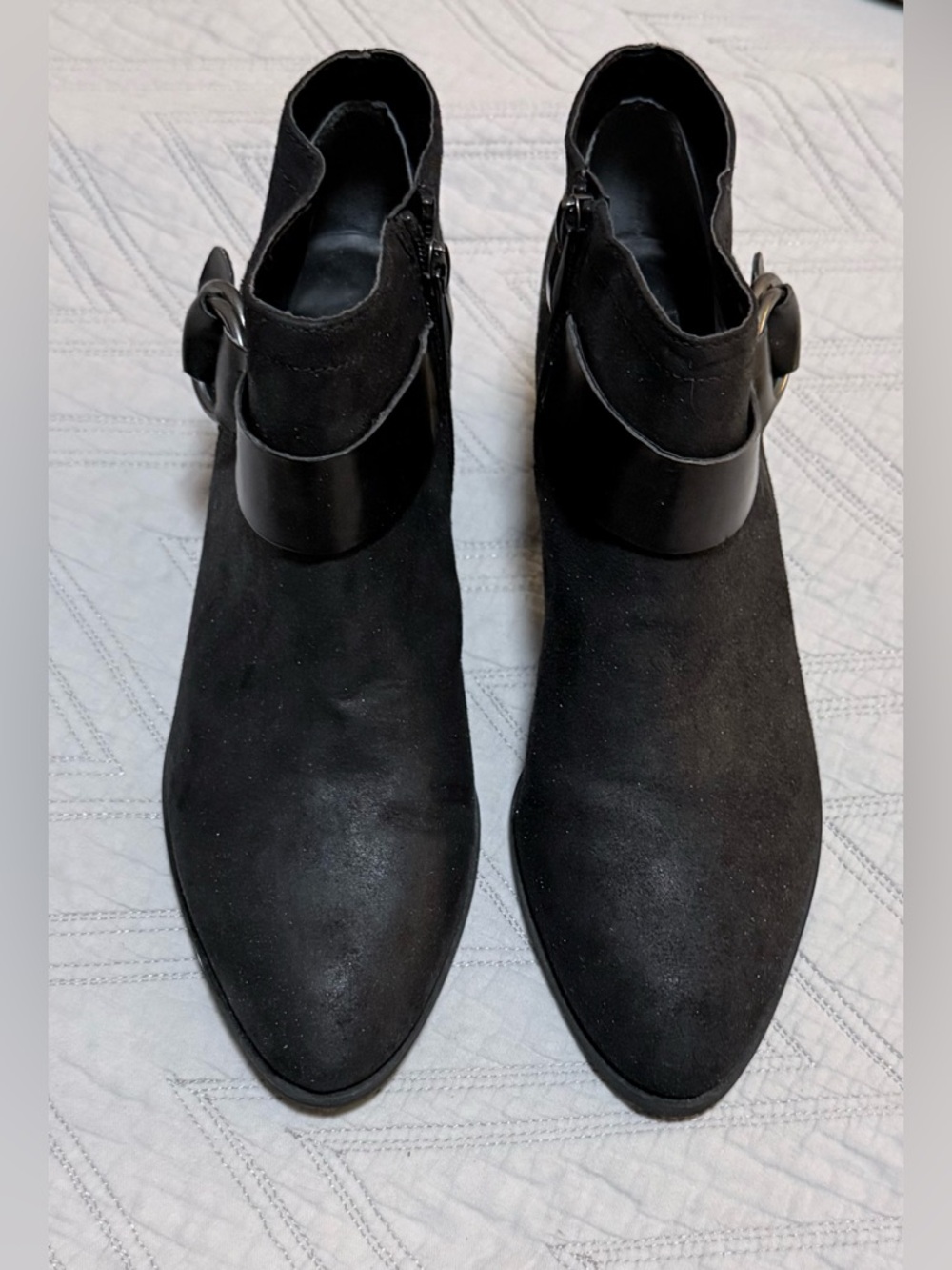 Black ankle boots with a buckle strap